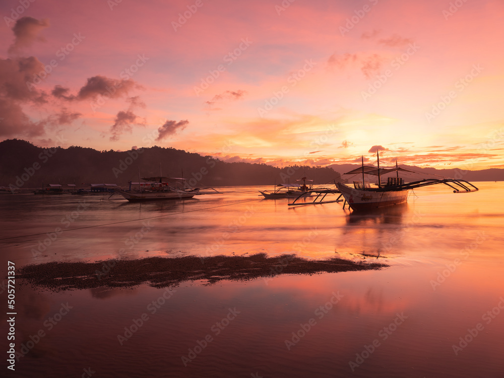 Sunset on the beach of Port Barton in Palawan, Philippines 