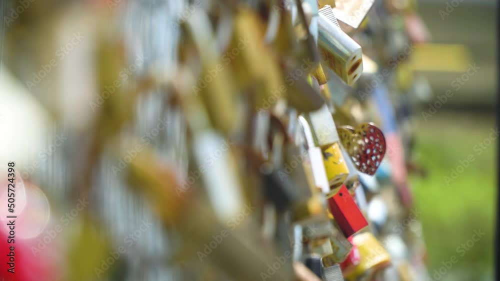 many padlocks locked on fence as a signature for couples to stay together forever with a love heart focused on blurry backround depth of field romantic vibes tradition locked together forever summery many padlocks locked on fence as a signature for couples to stay together forever with a love heart focused on blurry backround depth of field romantic vibes tradition locked together forever summery