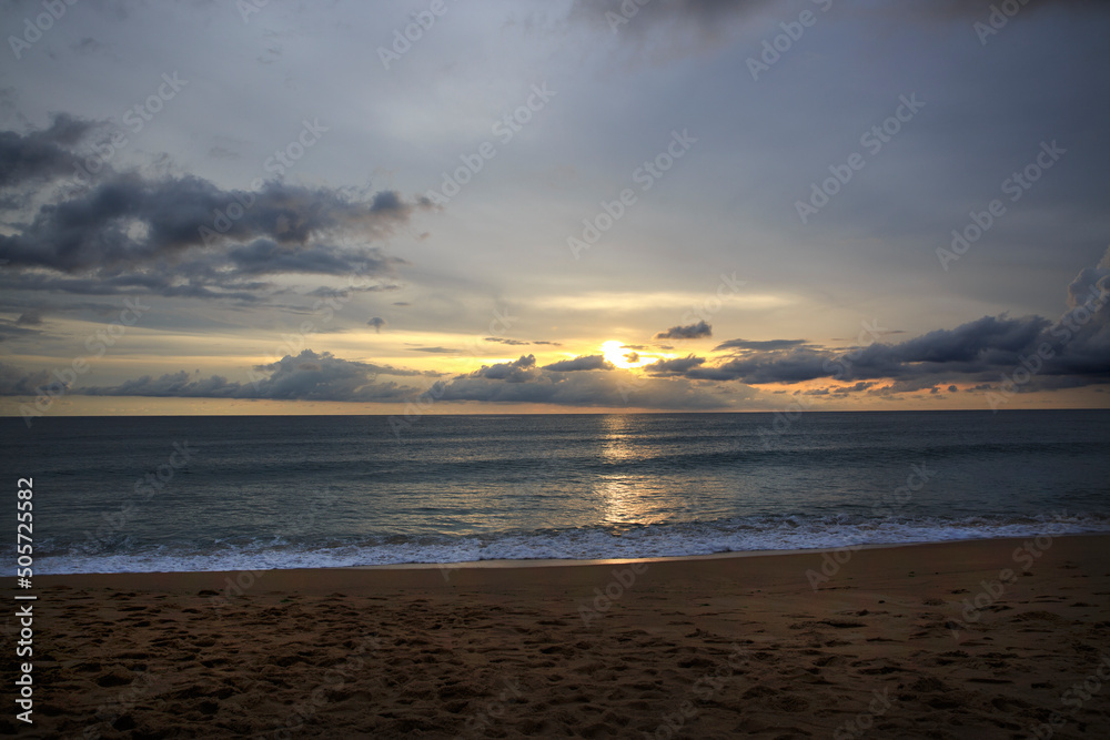 Beautiful sunset and blue sky over the beach with soft wave tropical in Thailand