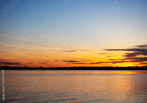 Colorful backdrop. Sea landscape. Blue sky. Sunset on the river.