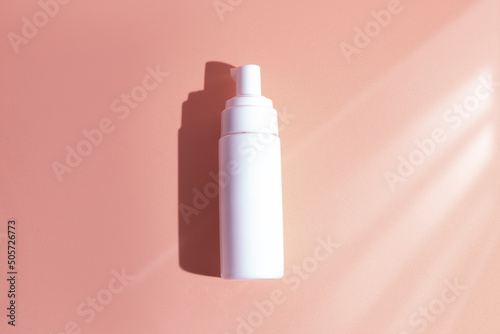 mockup of medical skin care bottle cosmetic tube of beauty makeup facial  treatment cleanser face foam  beauty healthcare branding packaging in water splash