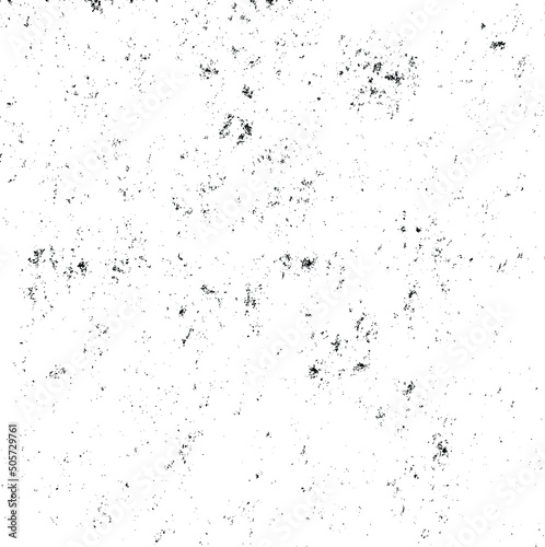 Small uneven spots and particles of debris. Abstract vector texture. Distressed uneven background. Grunge texture overlay with fine grains isolated on white background. Vector illustration. EPS10.