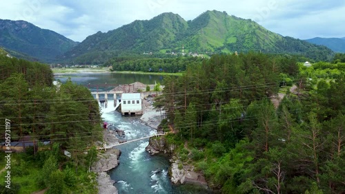 Altai, Russia - 06.21.2021: Panoramic video of the Altai hydroelectric power station on the mountain river Katun.