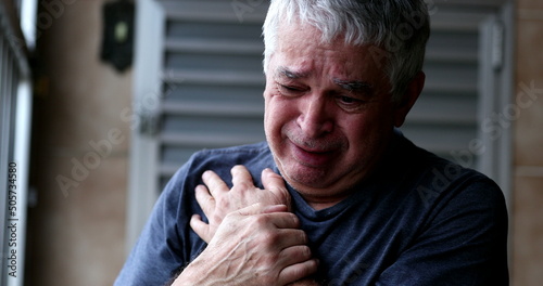 Crying older man looking to sky asking for God help. Senior person in despair feeling lost