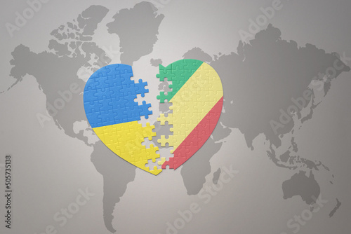 puzzle heart with the national flag of ukraine and republic of the congo on a world map background. Concept.