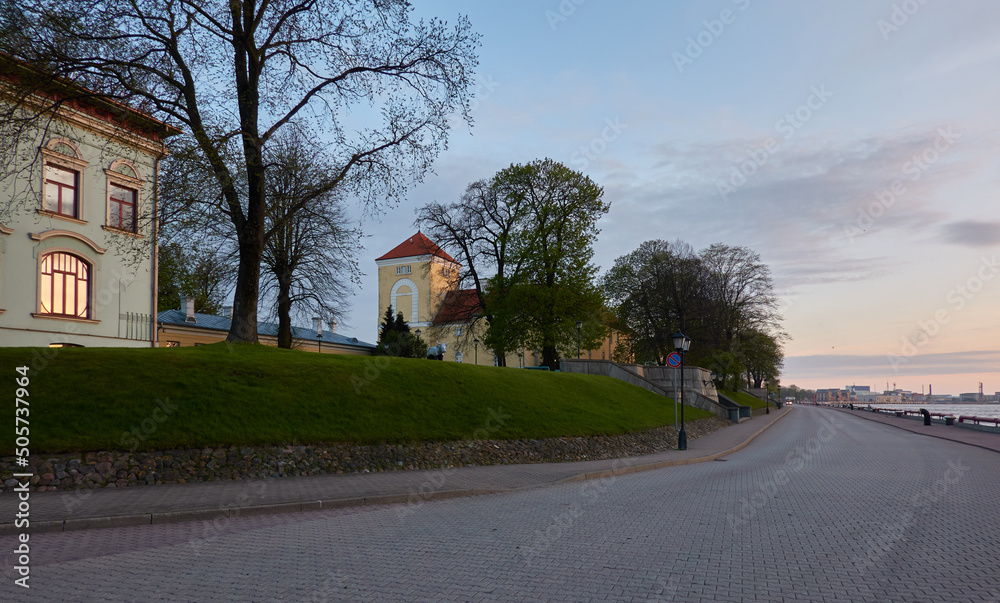 Fotografie An old castle at sunset, tower close-up
