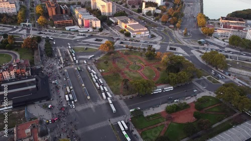 Aerial birds eye shot of many buses parking at train station ,waiting for passengers of train station - Retiro Train Station,Buenos Aires