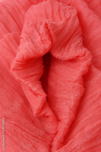 Obraz na płótnie Soft folds of pink fabric in the shape of vagina. Textile abstract background. Sexy concept. Closeup. Selective focus. w salonie