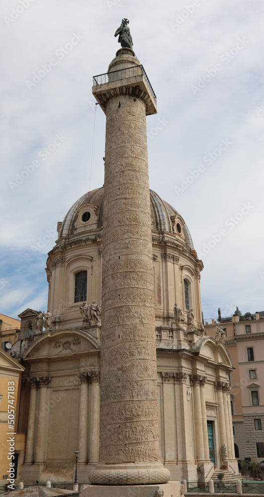 Roman Trajans Column with a high relief and the Church of the Most Holy Name of Mary at the Trajan Forum