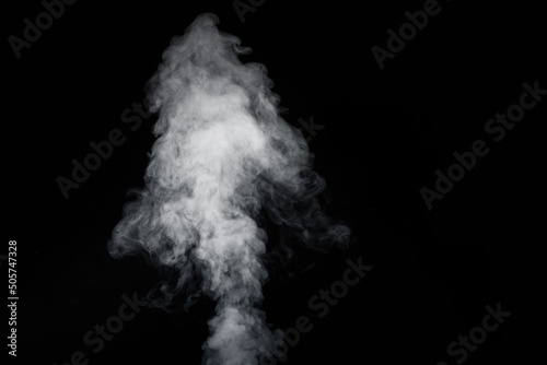 Curly white steam rising up and splashing water scattering in different directions isolated on a black background. Can be used as background, design element