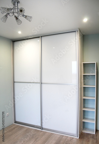 Wardrobe with sliding doors. Furniture. Interior design
