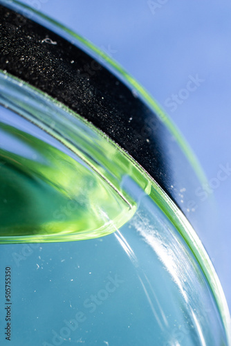 Perfume bottle with green liquid inside