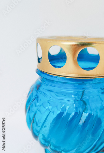 An unquenchable lamp made of blue glass. Candle for the grave with a lid. A memorial candle. A memory candle.