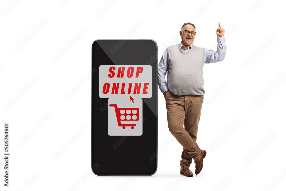 Mature man leaning on a big mobile phone with text shop online and pointing up Mature man leaning on a big mobile phone with text shop online and pointing up
