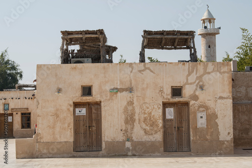 Doha, Qatar, May 5,2022: Traditional Arabian building built of wood and mud decorated with a facade in the traditional Arabic style.