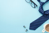 Father's Day concept. Top view photo of cup of coffee glasses cufflinks and blue necktie on isolated pastel blue background with copyspace