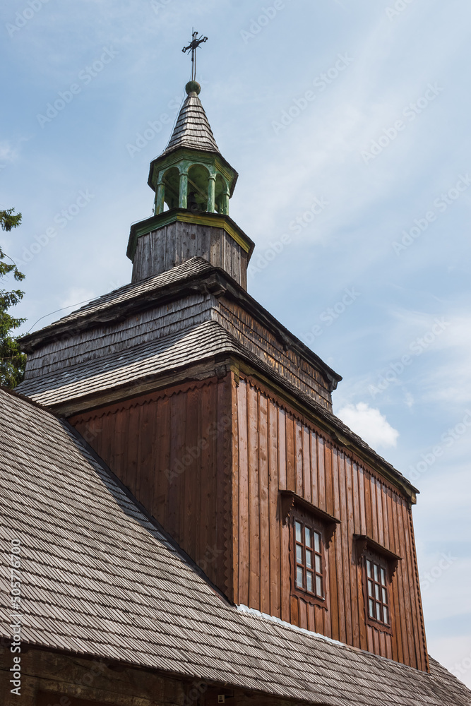 A fragment of the upper tiers of an old wooden church. Ancient orthodox wooden Ukrainian church. A fragment of the upper tiers of an old wooden church. Ancient orthodox wooden Ukrainian church.