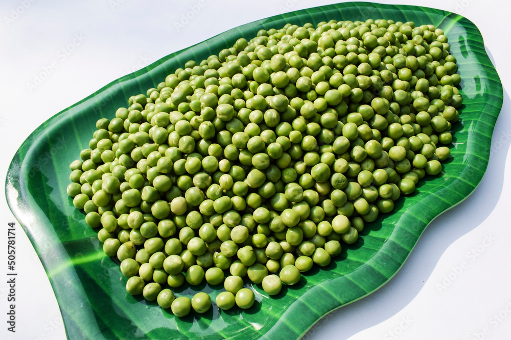 Top view of Fresh Green peas. Organic green vegetables in bowl with multicolor background. Hara matar dana Green pea seeds raw tender. Space to write text font - obrazy, fototapety, plakaty 