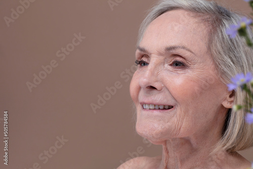 Studio shot of smiling senior woman photo