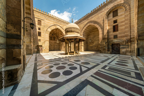 Egypt, Cairo, Colorful floor in stone courtyard in Islamic district photo