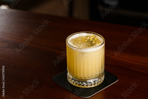 Obraz na płótnie Alcoholic Scotch Whiskey Penicillin Drink Cocktail with Lemon, Honey syrup and Candied Ginger. Cocktail glass on black background w salonie
