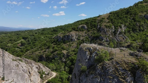 Zdrelo Gorge near village Stogazovac in Serbia near Knjazevac rocks and cliff stream valley nature outdoor mountain no people in sunny day with orthodox cross on the top of the rock photo