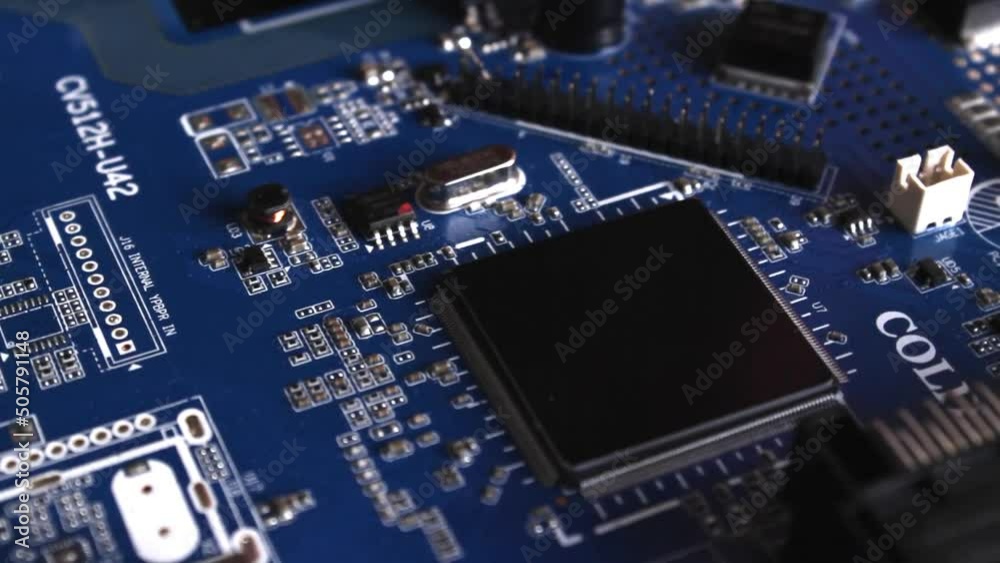 Blue circuit board close up, seamless loop rotating. Computer components industry Blue circuit board close up, seamless loop rotating. Computer components industry