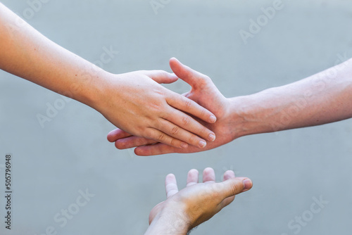 mediation concept - hands shaking in agreement with mediator photo