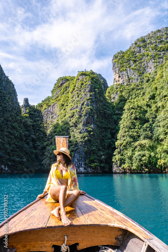 фотография Koh Phi Phi Thailand, Asian woman in longtail boat exploring the Phi Phi Lagoon around the Island