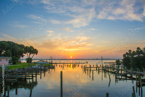 Sunrise on the Indian River at an old marina with wooden piers in Mebourne, Florida. 