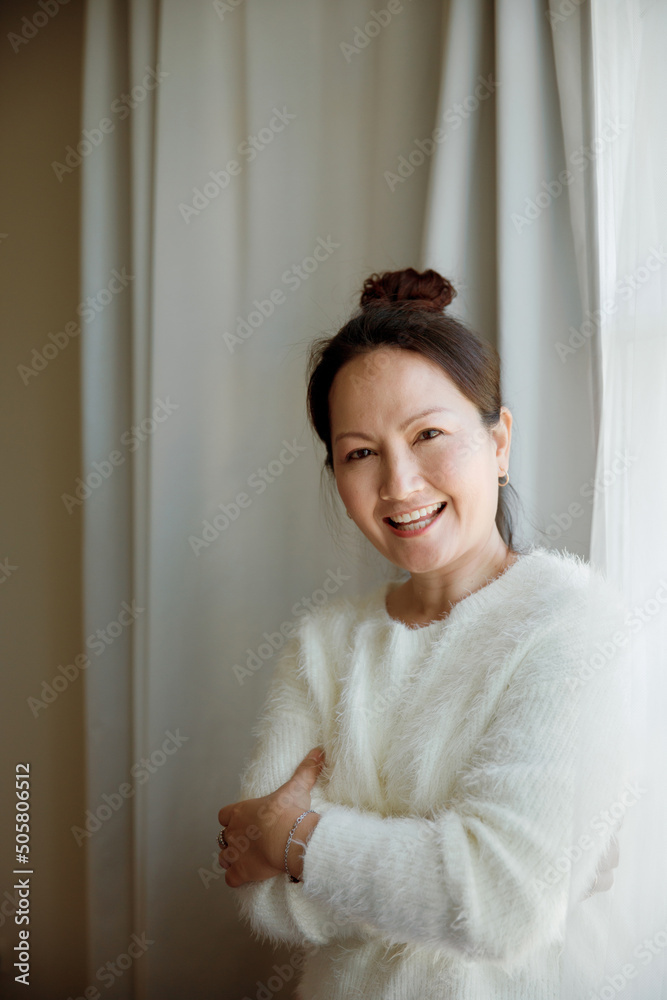 A happy and cheerful woman at home A happy and cheerful woman at home