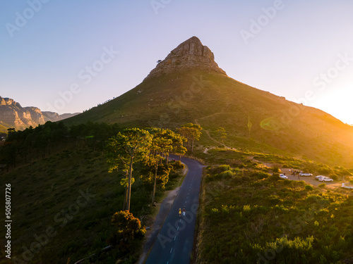sunset at Signal Hill Cape Town South Africa, sunset with a view at Lions Head and Camps Bay Cape Town. Couple man and woman watching sunset