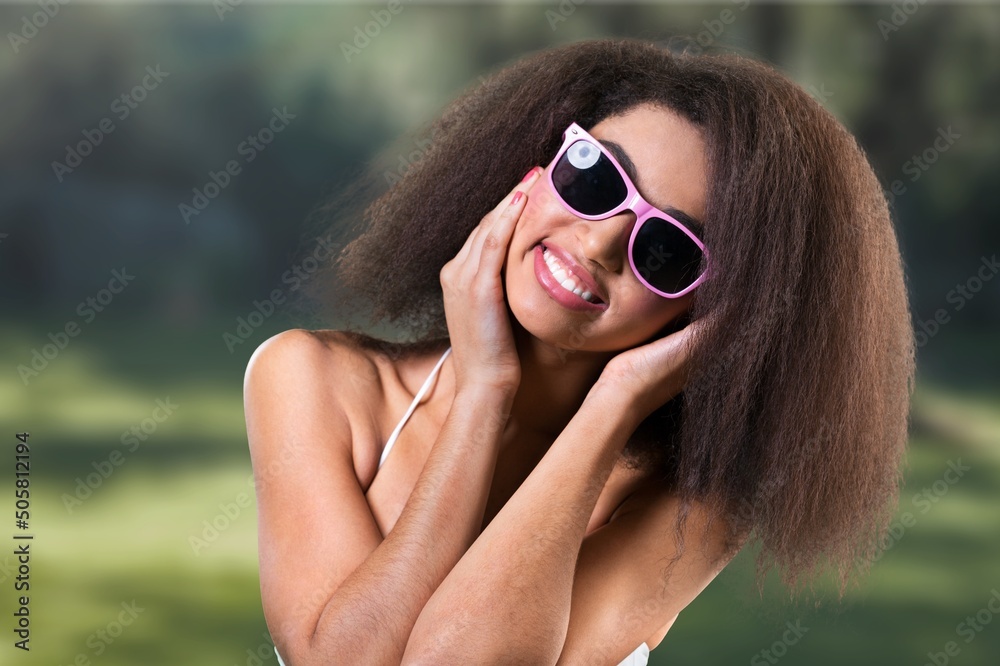 Glamour african woman in dress enjoying outdoor party or event, feeling happy Glamour african woman in dress enjoying outdoor party or event, feeling happy