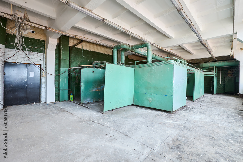 Old abandoned brick building with green walls Old abandoned brick building with green walls