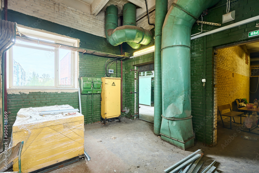 Old abandoned brick building with green walls Old abandoned brick building with green walls