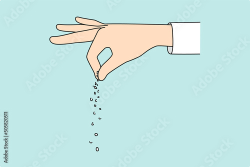 Close up of hand salt food 