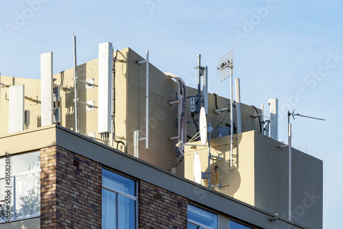 closeup of tv antennas  satellite dishes and electronic telecommunication equipment on top of a residential building concept technology in South Africa