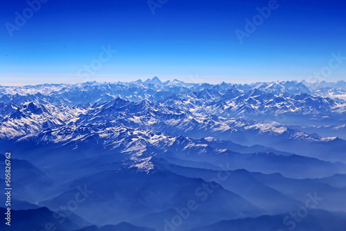 View of the high mountain on the window of air plane