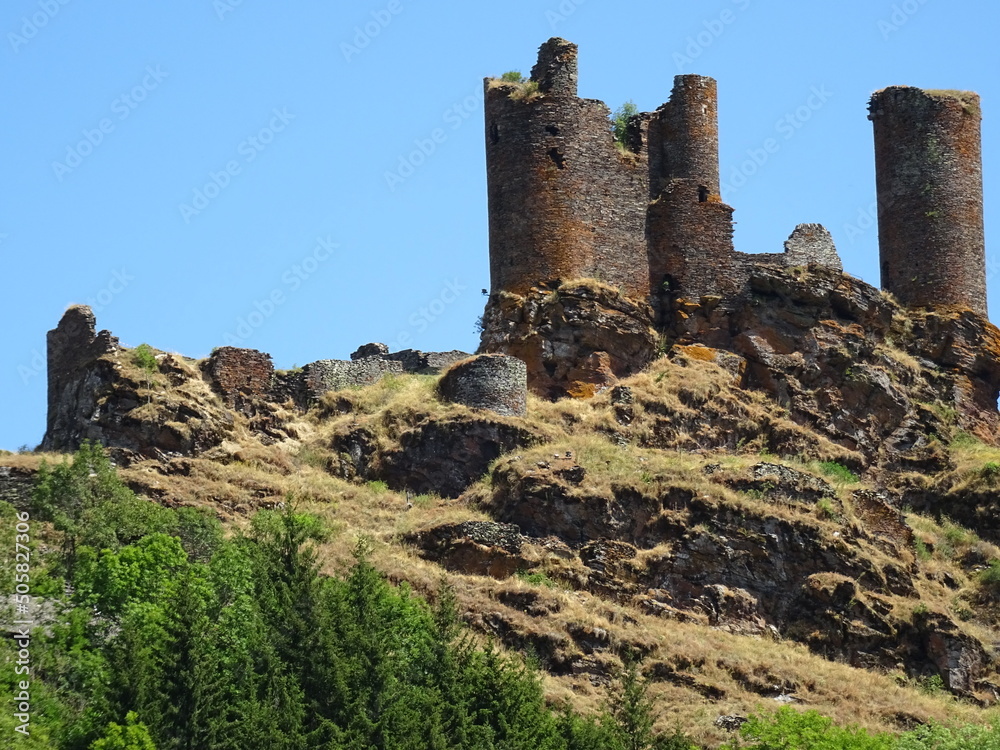 old stone ruins of castle in France on rocky hill