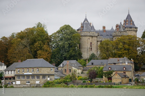 castle of Combourg, Brittany, France dominating the village and ocean photo