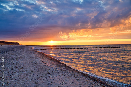 Fototapeta Naklejka Na Ścianę i Meble -  Sunset on the Baltic Sea. Sea, bean strong colors. Vacation on the beach. Landscape