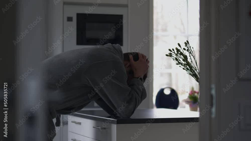 Depressed man in housecoat at home, Unemployment concept, medium shot