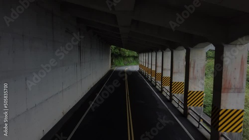 Wallpaper Mural Backward dolly through concrete tunnel on a lush green mountain pass in Taiwan Torontodigital.ca