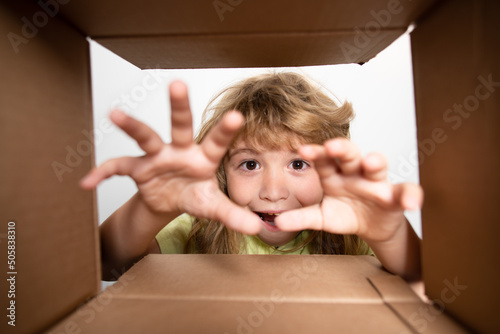 Unpacking cardboard box for kids. Child open carton delivery box, packaging open and closed cardboard box.