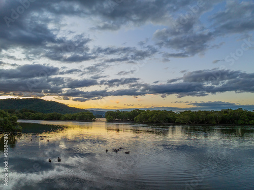 Fototapeta Naklejka Na Ścianę i Meble -  Scenic sunset with clouds at the waterfront