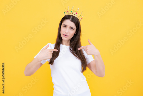 Obraz na plátně Portrait of young lovely expression woman in crown, isolated studio portrait
