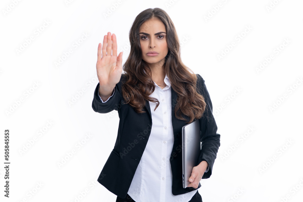 Portrait of young businesswoman using laptop computer isolated on gray background. Business women in suit with laptop. Portrait of business lady holding notebook. Portrait of young businesswoman using laptop computer isolated on gray background. Business women in suit with laptop. Portrait of business lady holding notebook.