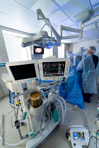 Monitoring of patient in surgical operating room in hospital. Emergency surgery modern technology.