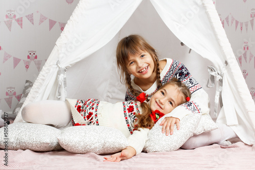 Fotografia, Obraz two girls who laugh, enjoy and play