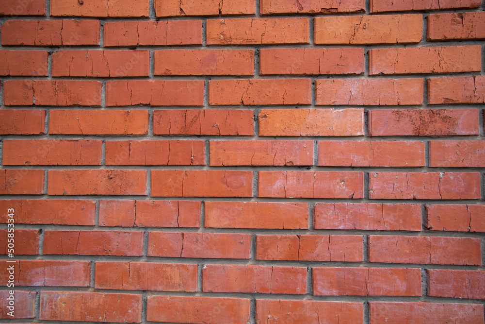 Background of red bricks. Elements of the facade of the building close-up.